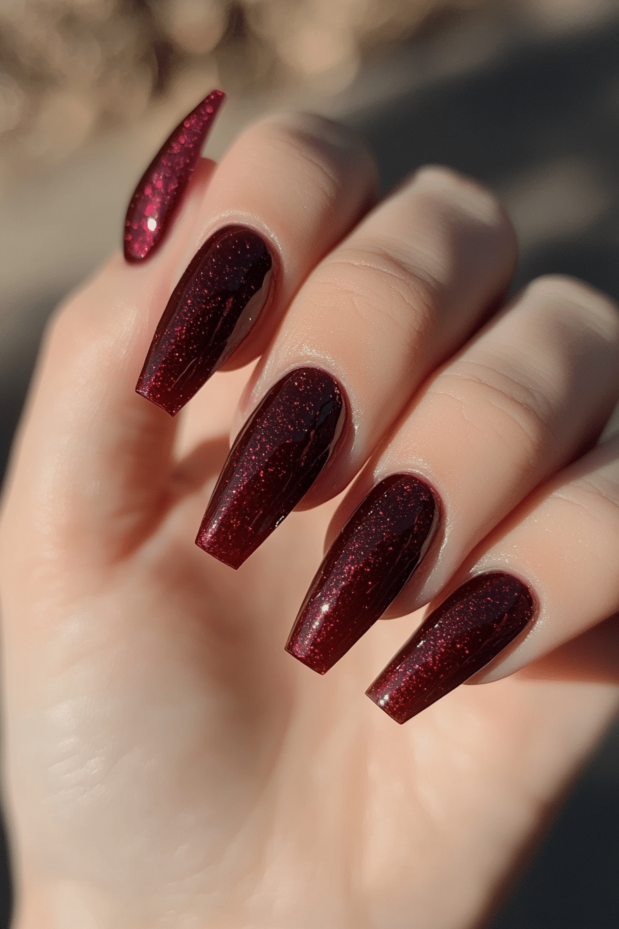 25. Spiced Sangria Shimmer (Dark Red Coffin Nail Design Ideas) - Dark Red Coffin Nail Design Ideas